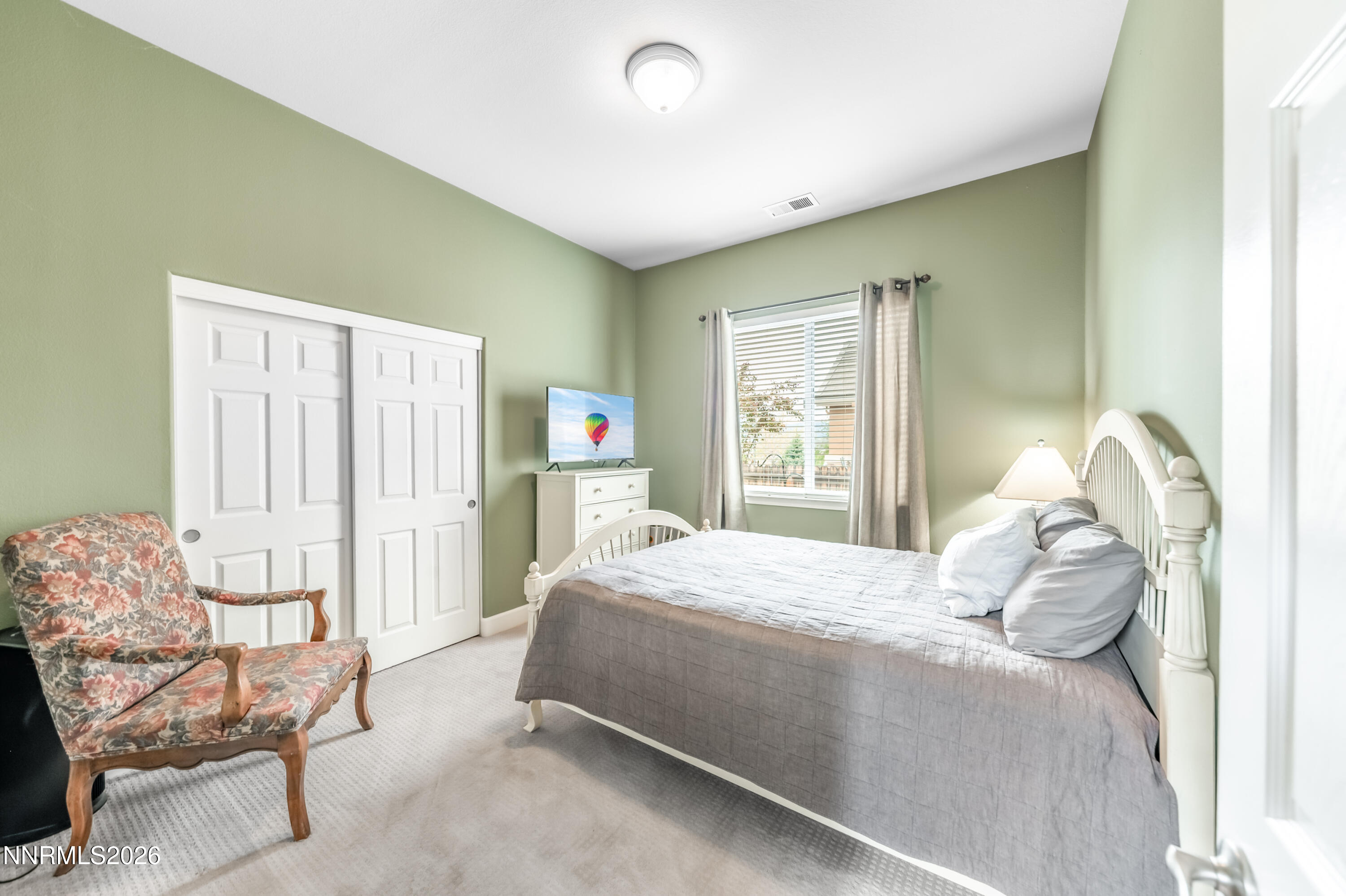 5865 Slate Drive Reno, NV 89523 - Photo 17 of 23 a bedroom with a bed chair and window