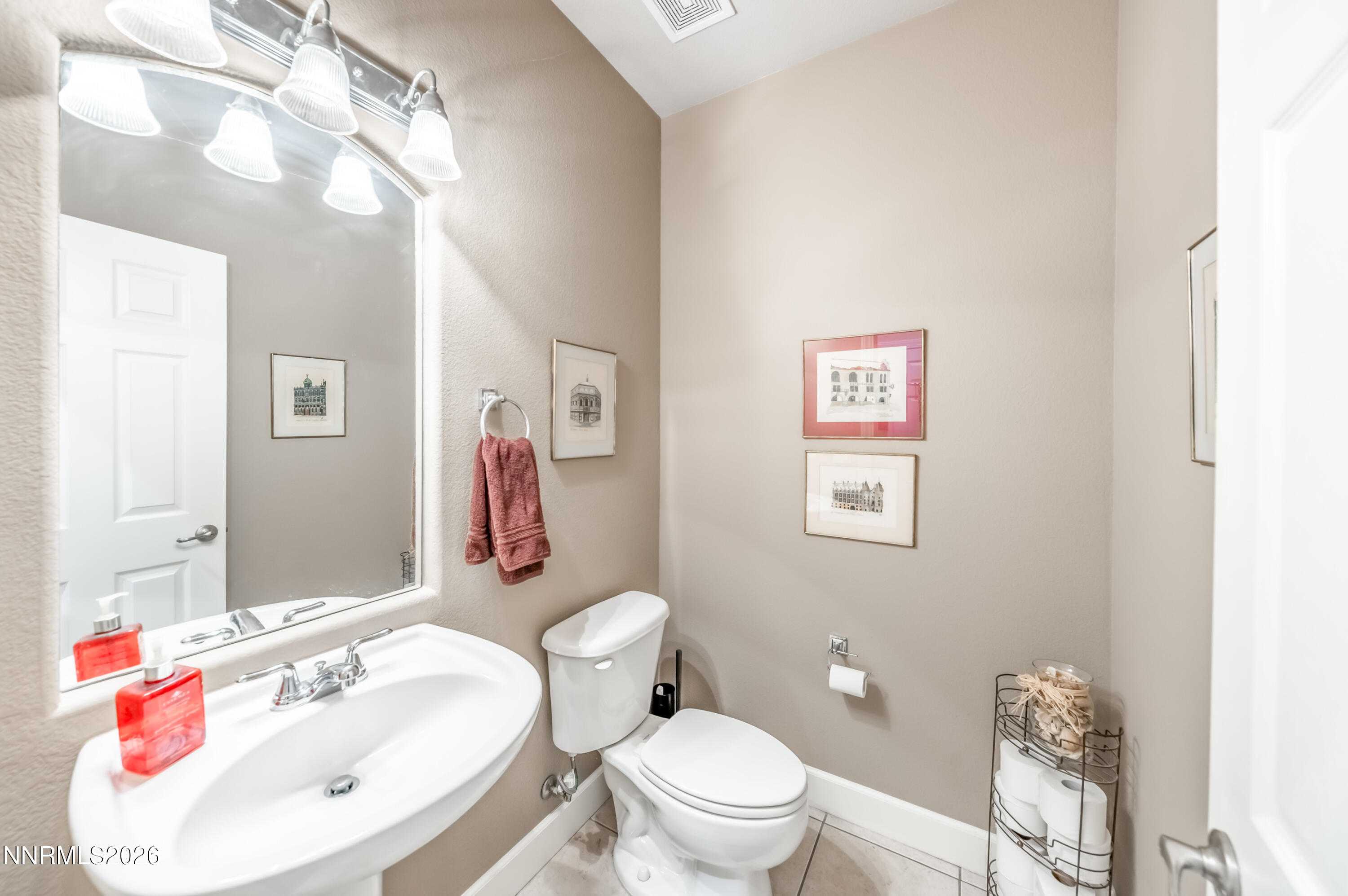 5865 Slate Drive Reno, NV 89523 - Photo 18 of 23 a bathroom with a toilet sink vanity tub and mirror