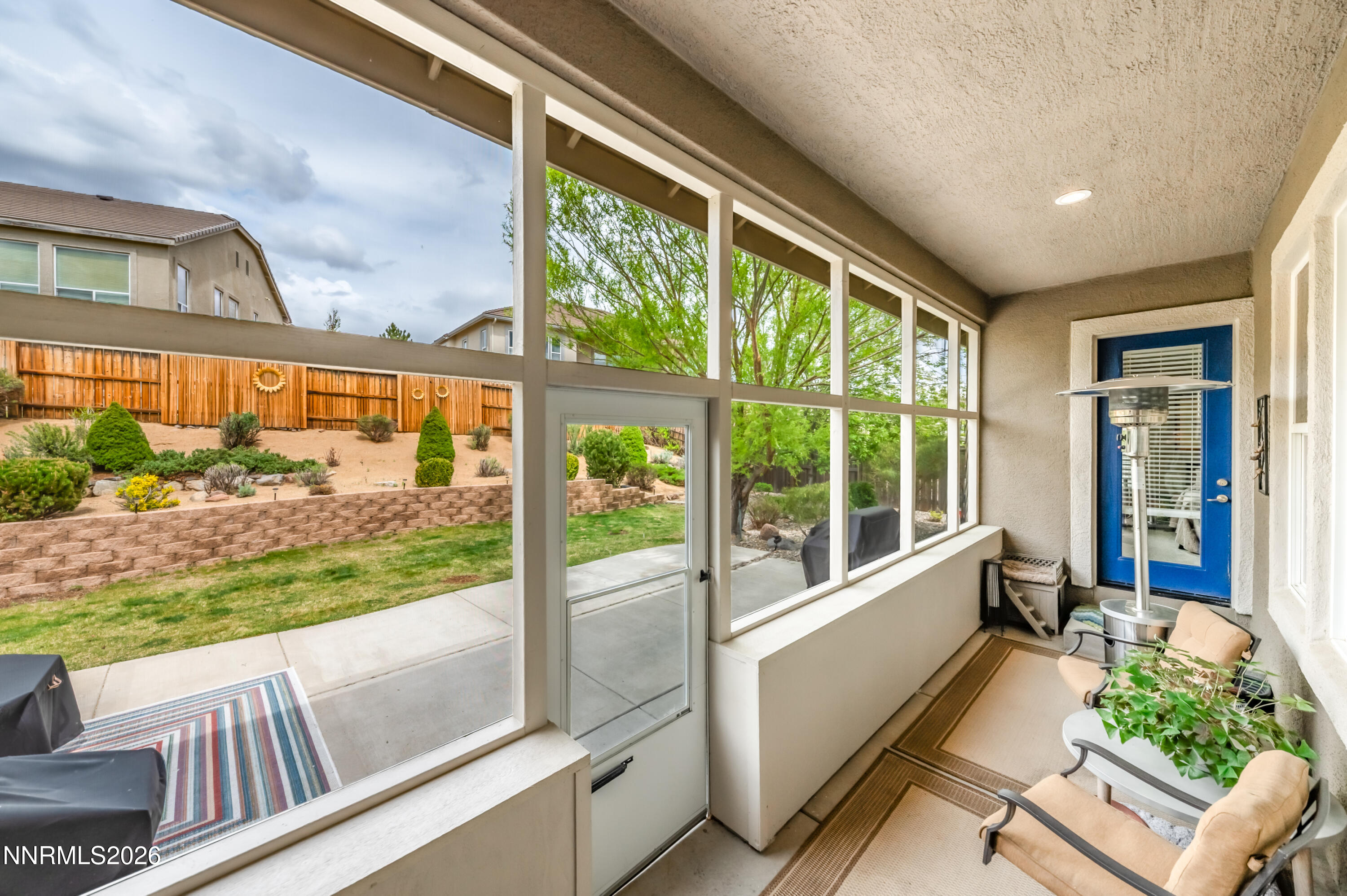 5865 Slate Drive Reno, NV 89523 - Photo 20 of 23 a view of a porch with furniture and a yard