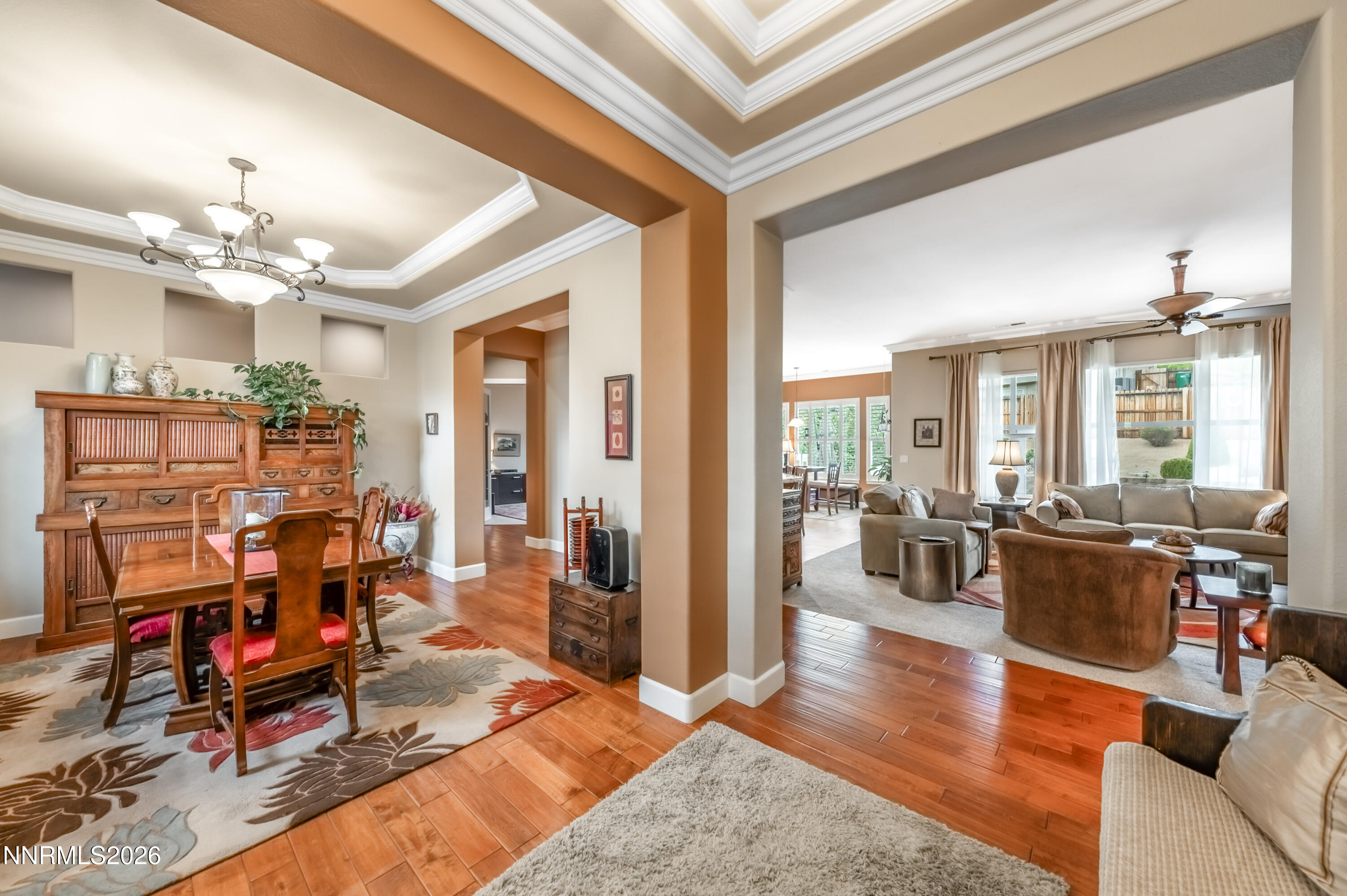 5865 Slate Drive Reno, NV 89523 - Photo 4 of 23 a living room with furniture dining table and a chandelier