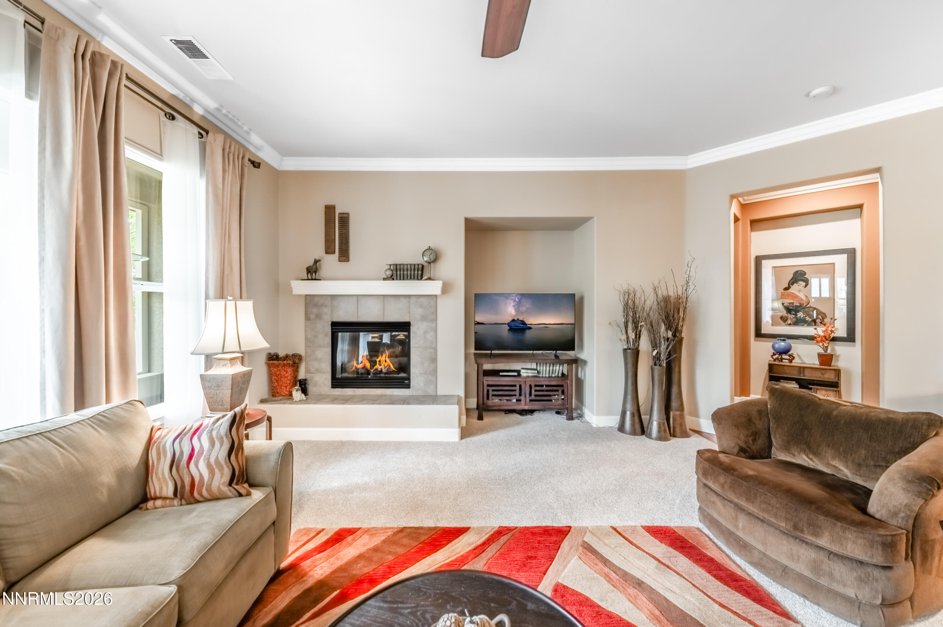5865 Slate Drive Reno, NV 89523 - Photo 7 of 23 a living room with furniture and a fireplace