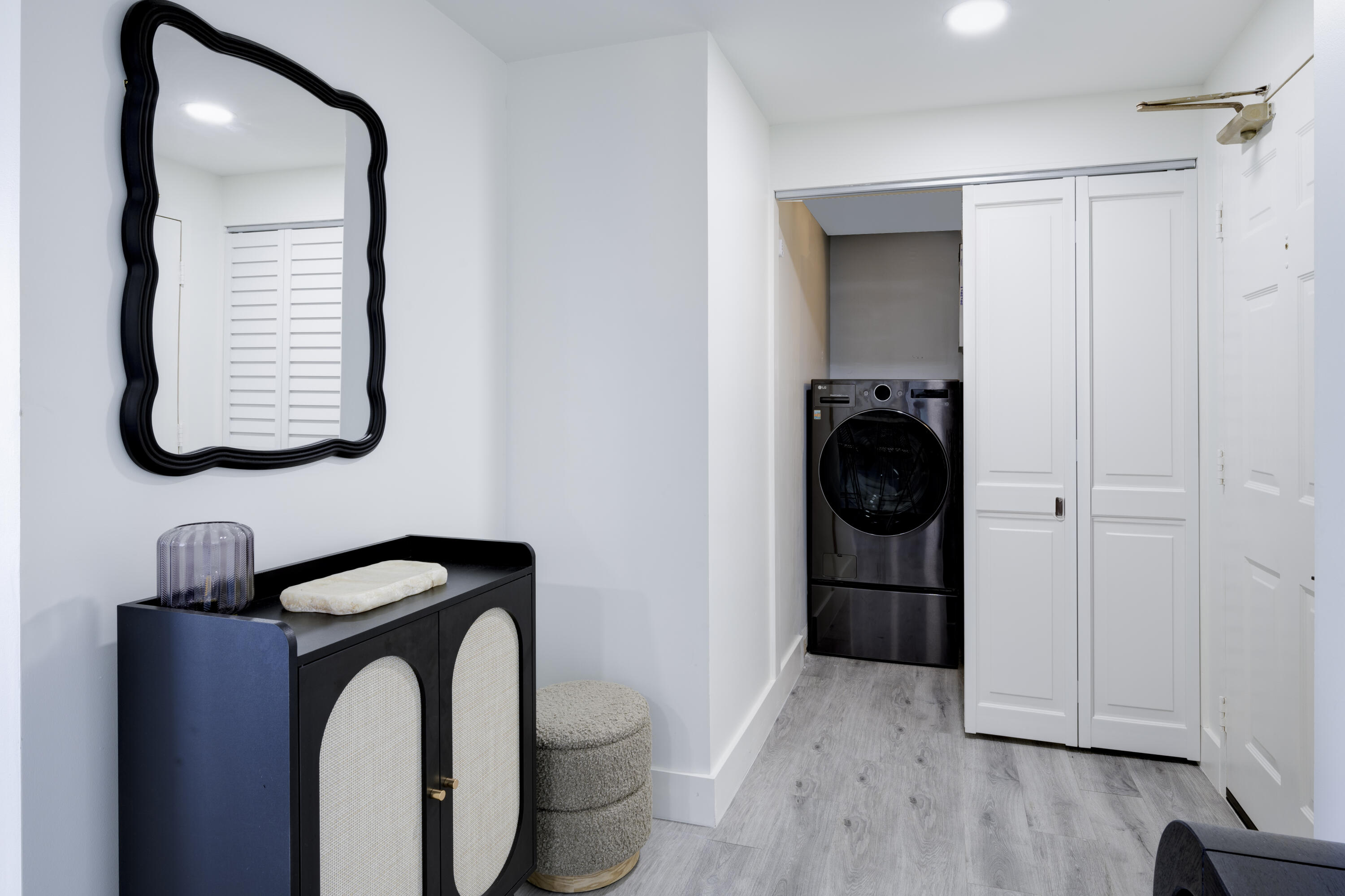 5600 North Flagler Drive, Unit 1207 West Palm Beach, FL 33407 - Photo 20 of 32 a bathroom with a toilet and a mirror