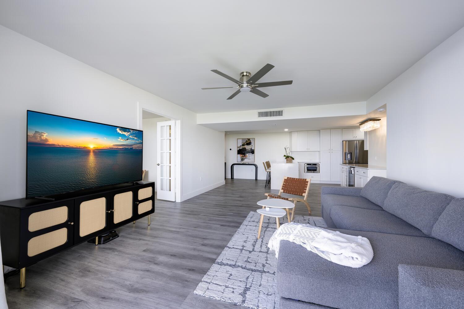 5600 North Flagler Drive, Unit 1207 West Palm Beach, FL 33407 - Photo 2 of 32 a living room with furniture and a flat screen tv
