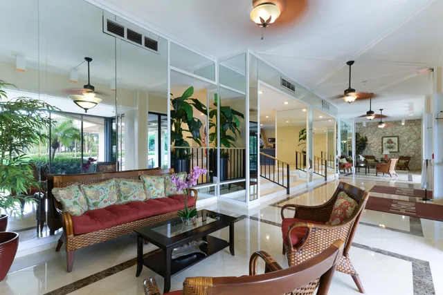 a view of a dining room with furniture wooden floor and chandelier