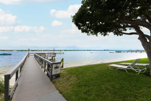 a view of a terrace with chairs and a lake view