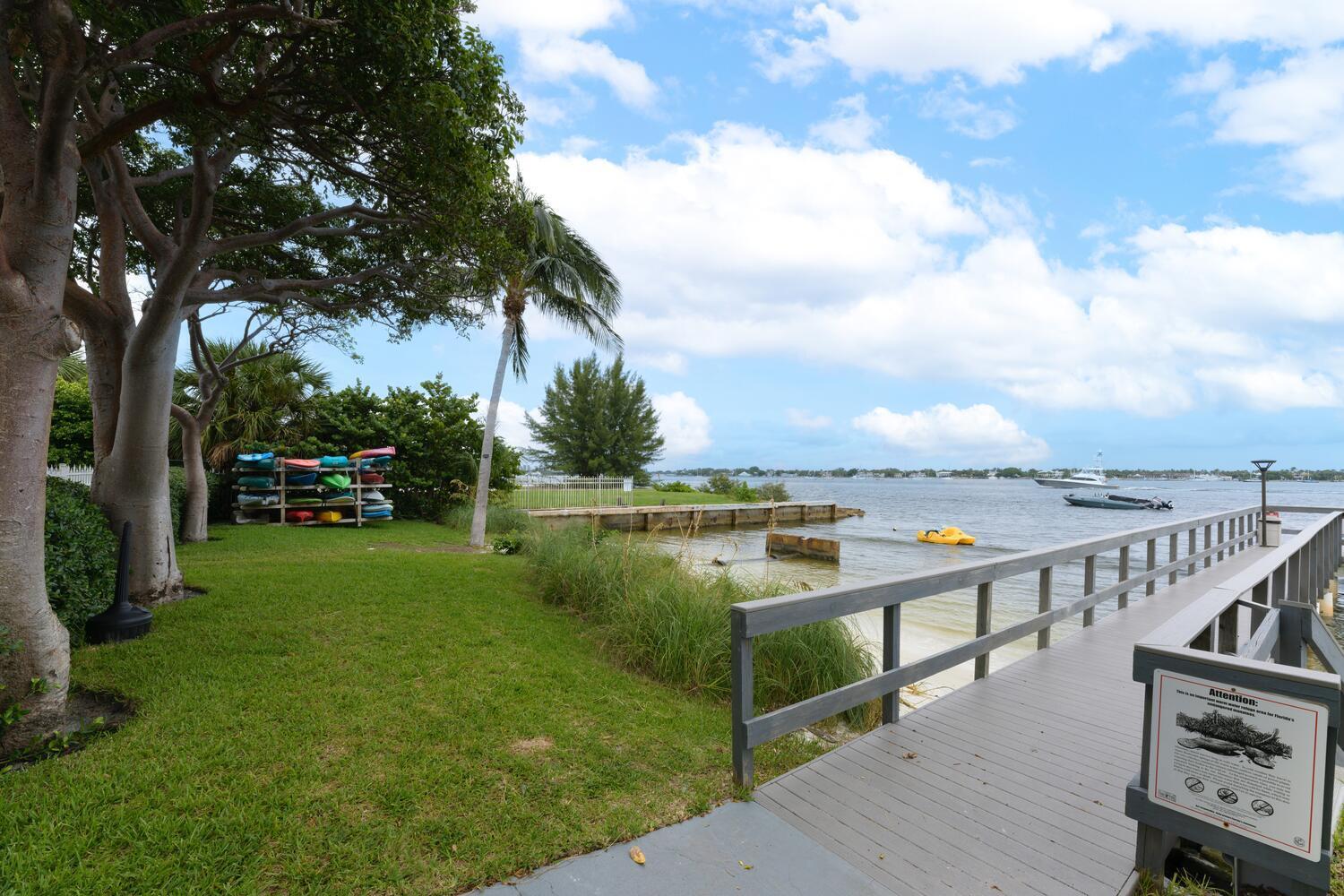 5600 North Flagler Drive, Unit 1207 West Palm Beach, FL 33407 - Photo 28 of 32 a view of a terrace with lawn chairs and a fire pit