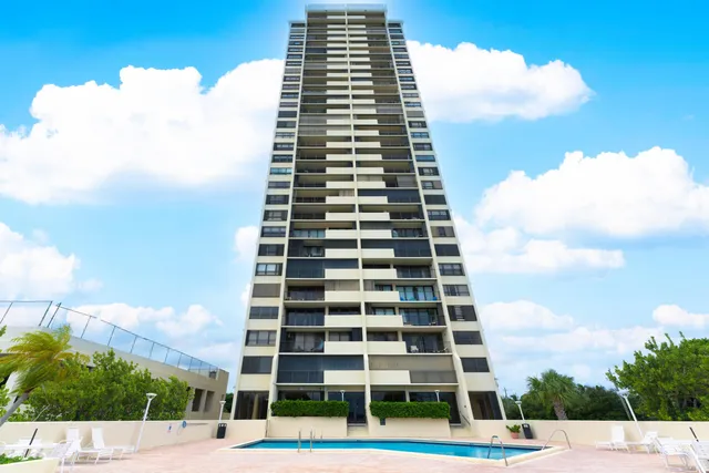 a view of a building with a yard