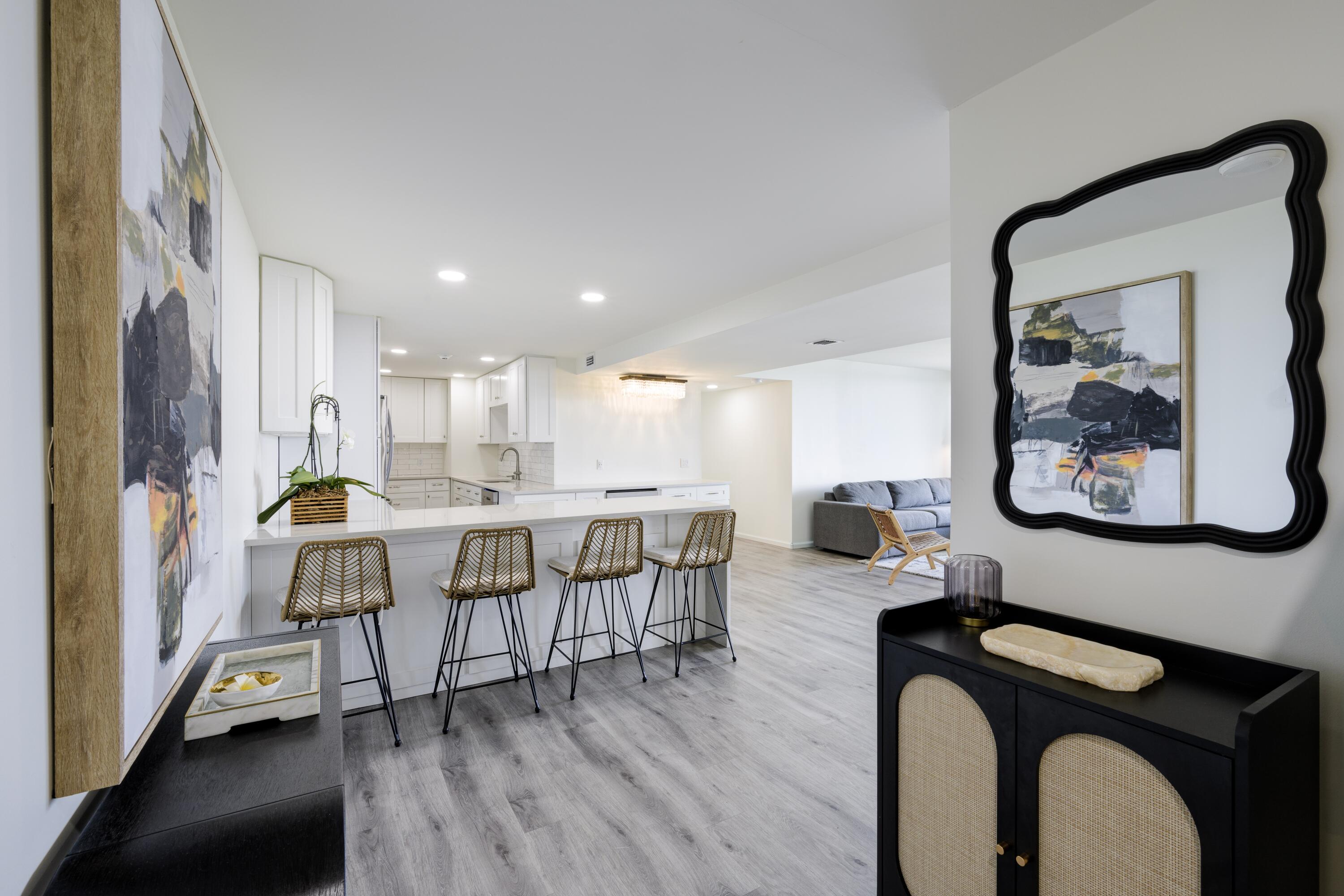 5600 North Flagler Drive, Unit 1207 West Palm Beach, FL 33407 - Photo 5 of 32 a view of a dining room with furniture window and wooden floor