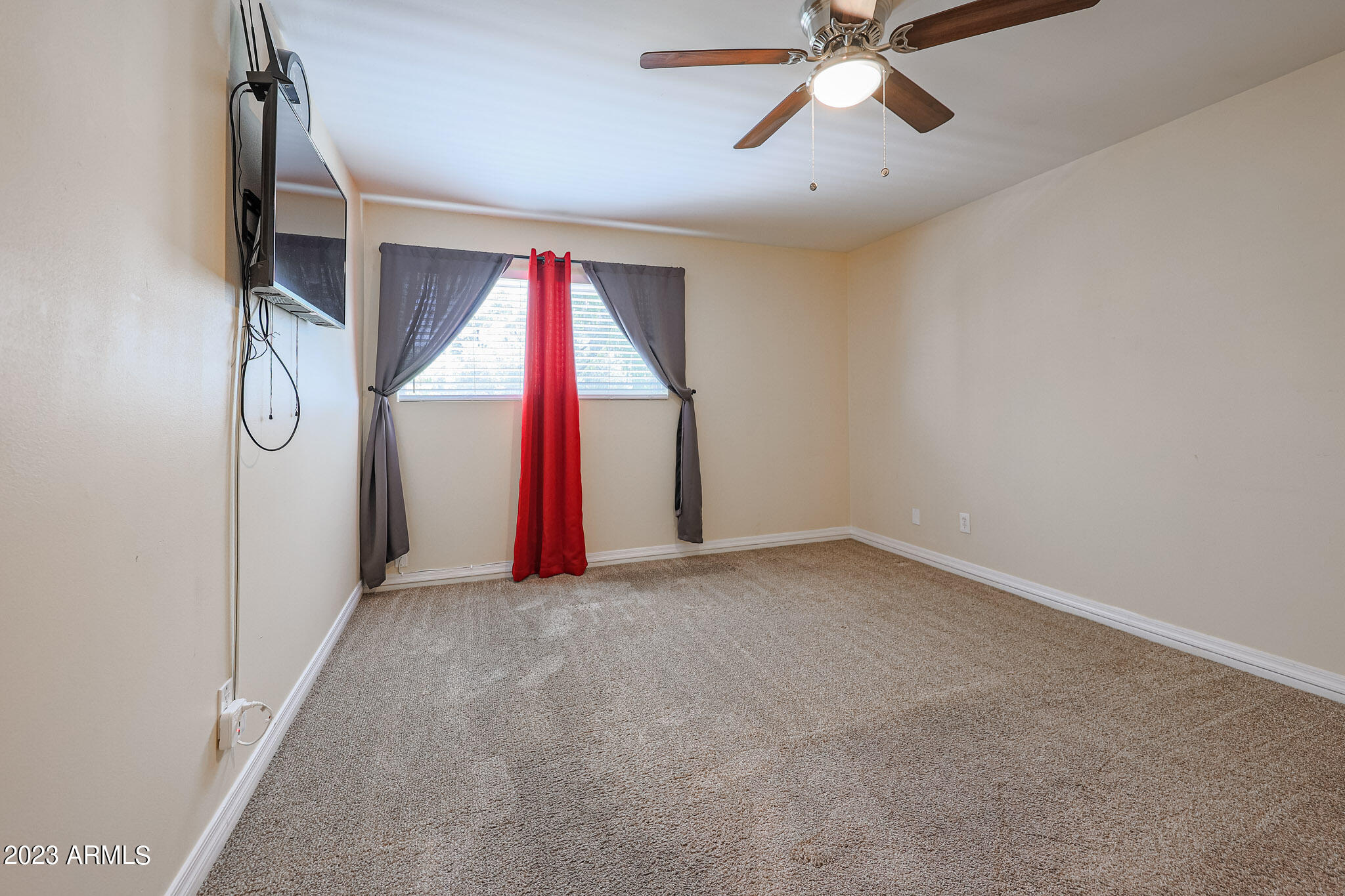 5550 North 12th Street, Unit 24 Phoenix, AZ 85014 - Photo 12 of 20 a view of empty room with ceiling fan
