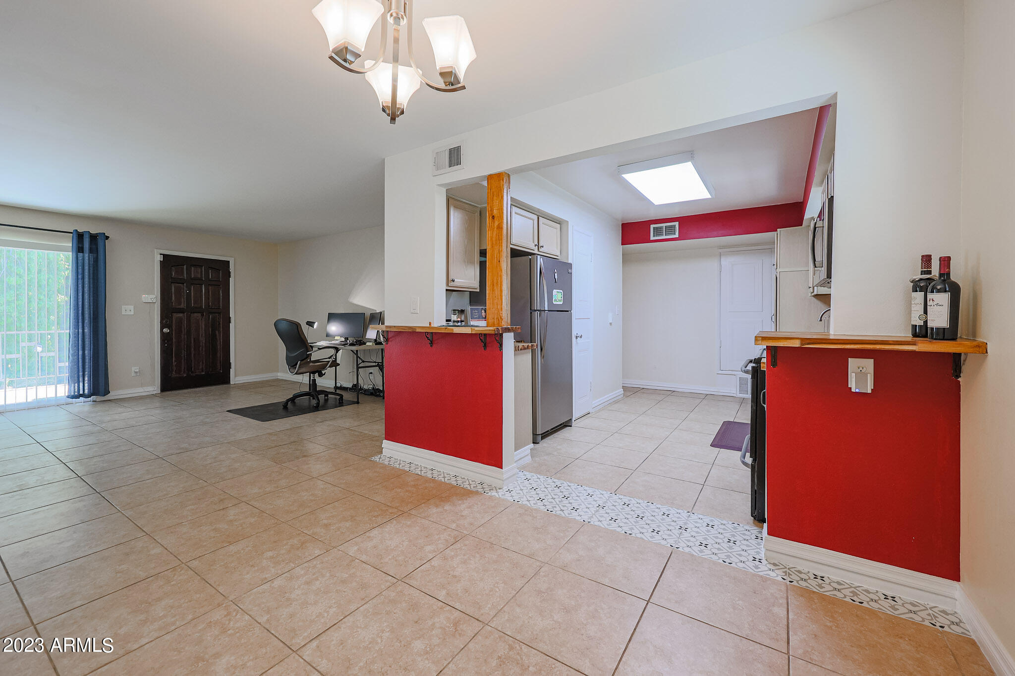 5550 North 12th Street, Unit 24 Phoenix, AZ 85014 - Photo 9 of 20 a view of kitchen with refrigerator cabinets and window