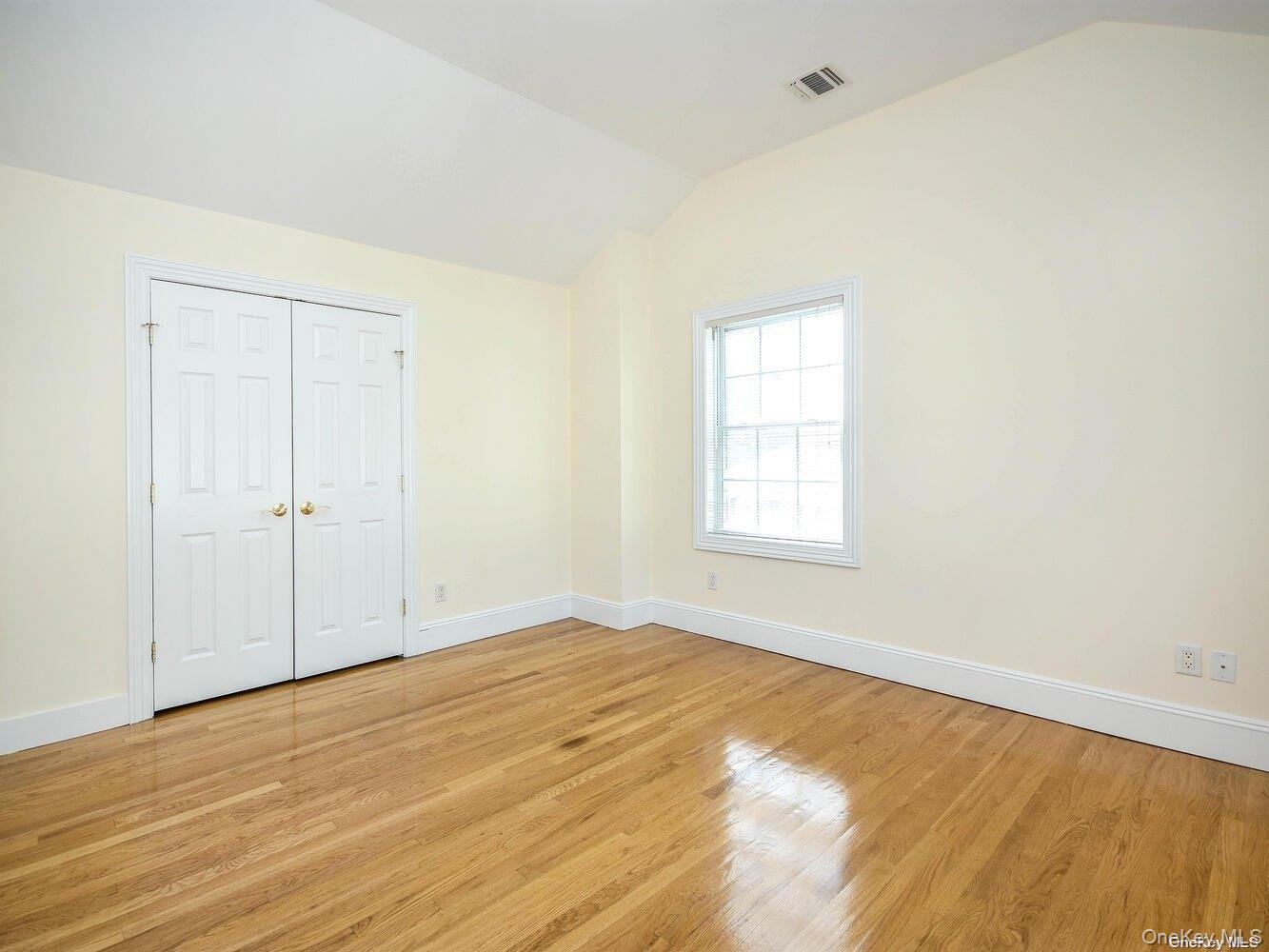 51 Inwood Road, Unit B Port Washington, NY 11050 - Photo 21 of 33 a view of an empty room and window