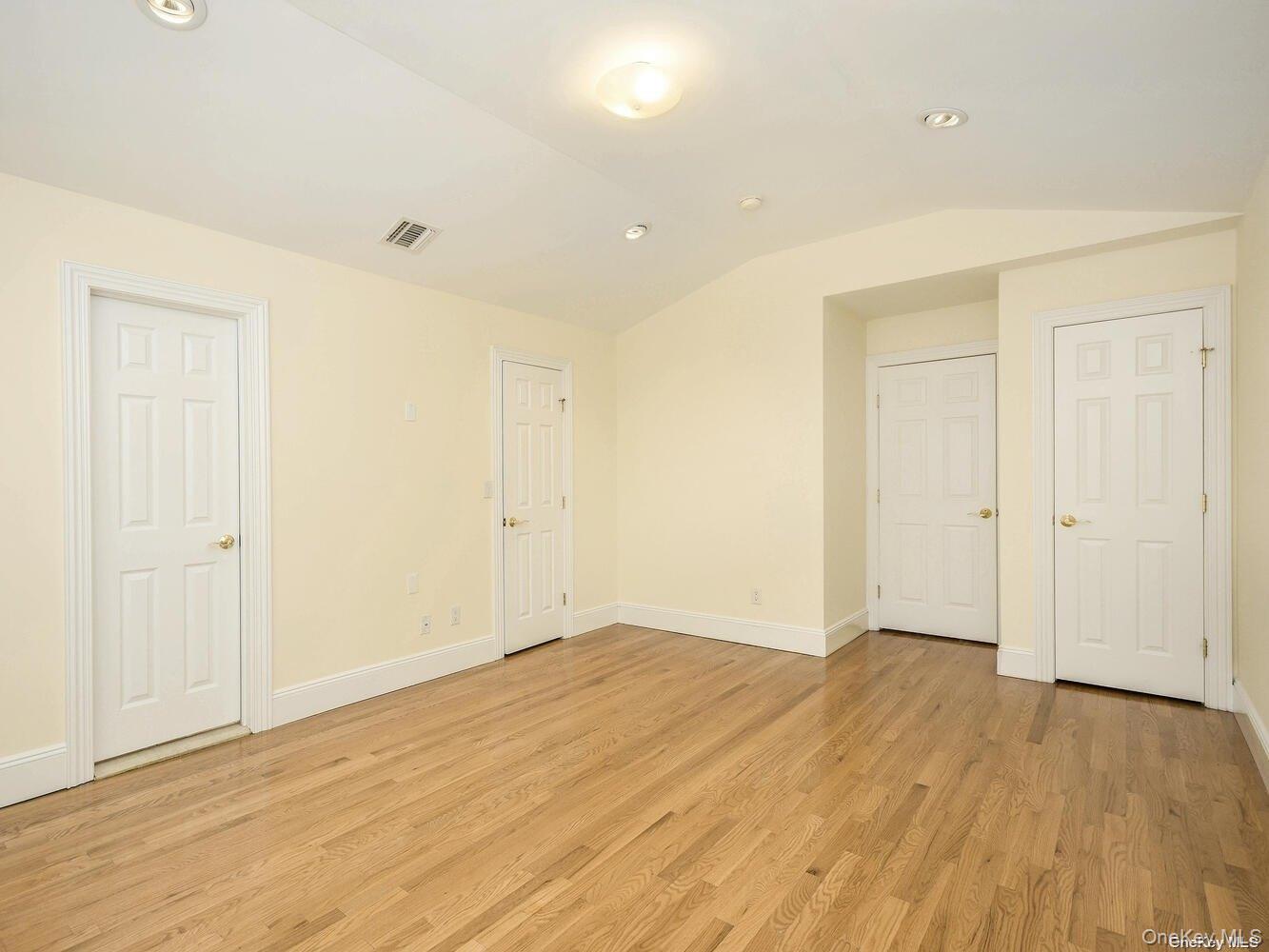 51 Inwood Road, Unit B Port Washington, NY 11050 - Photo 25 of 33 wooden floor in an empty room with a window