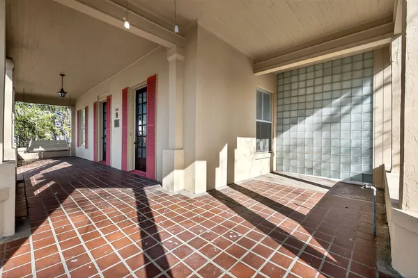 a view of a kitchen with a stove wooden floor and a ceiling fan