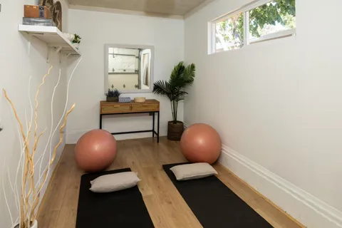 a view of bathroom with a sink and mirror