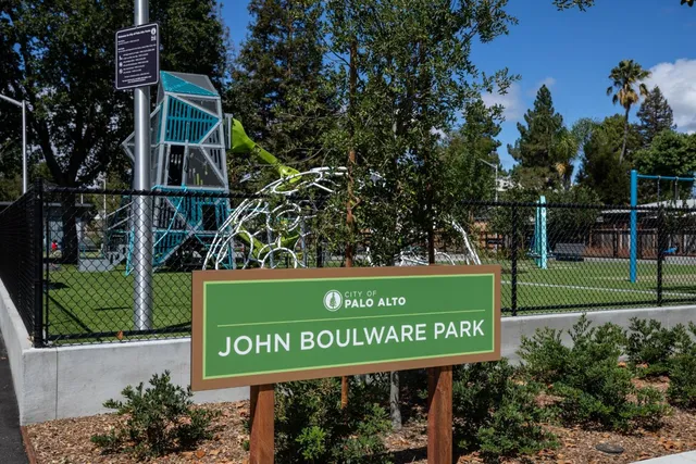 a view of a park with large trees