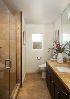 a kitchen with a sink appliances and cabinets
