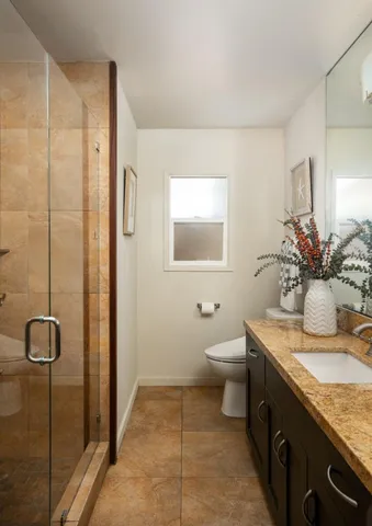 a kitchen with a sink appliances and cabinets