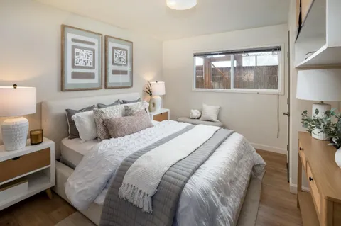 a bathroom with a sink a toilet and window