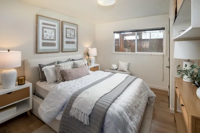 a bathroom with a sink a toilet and window