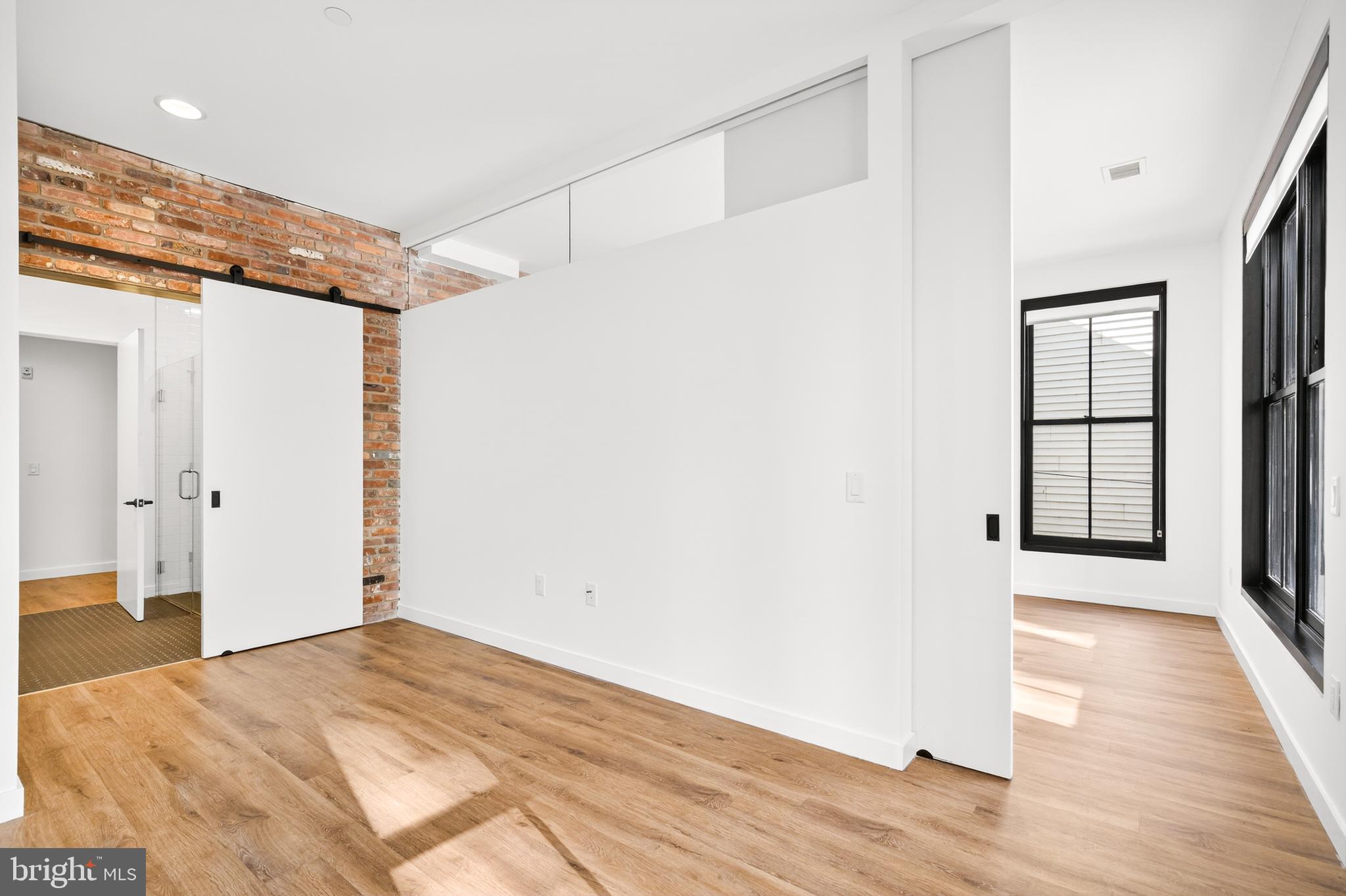 57 N Street Northwest, Unit 302 Washington, DC 20001 - Photo 20 of 34 a view of a room with wooden floor