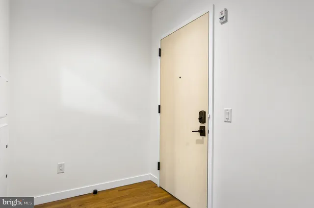 a view of a small space with wooden floor