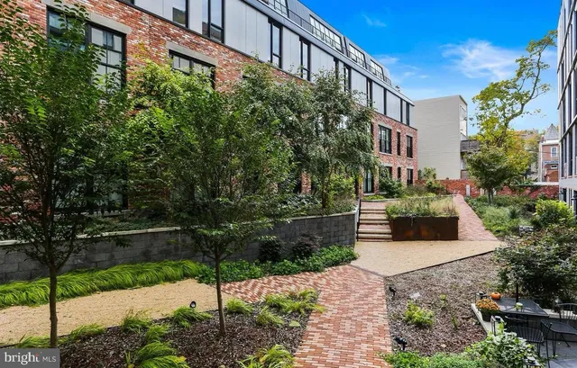 a view of a building with a bench in front of it