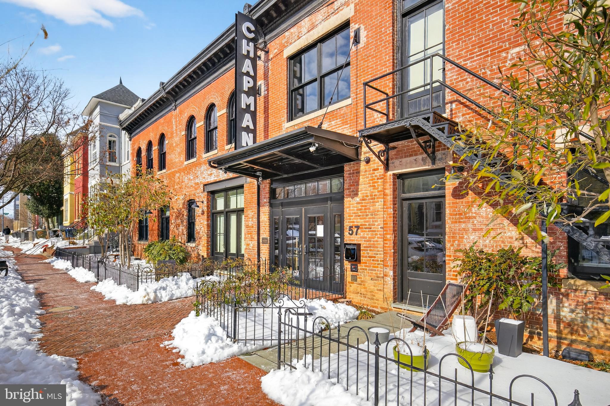 57 N Street Northwest, Unit 302 Washington, DC 20001 - Photo 32 of 34 a view of a building with a bench in front of it