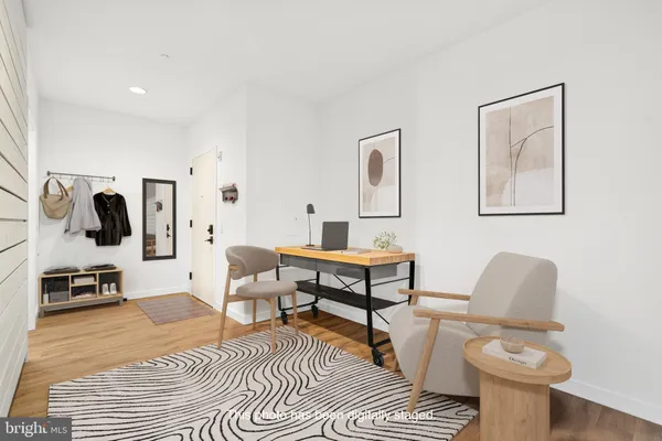 a living room with furniture and a rug