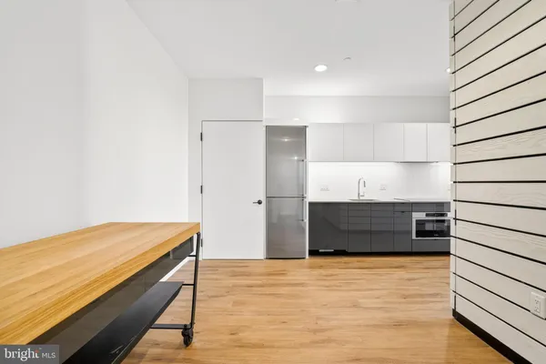 a room with closet and wooden floor
