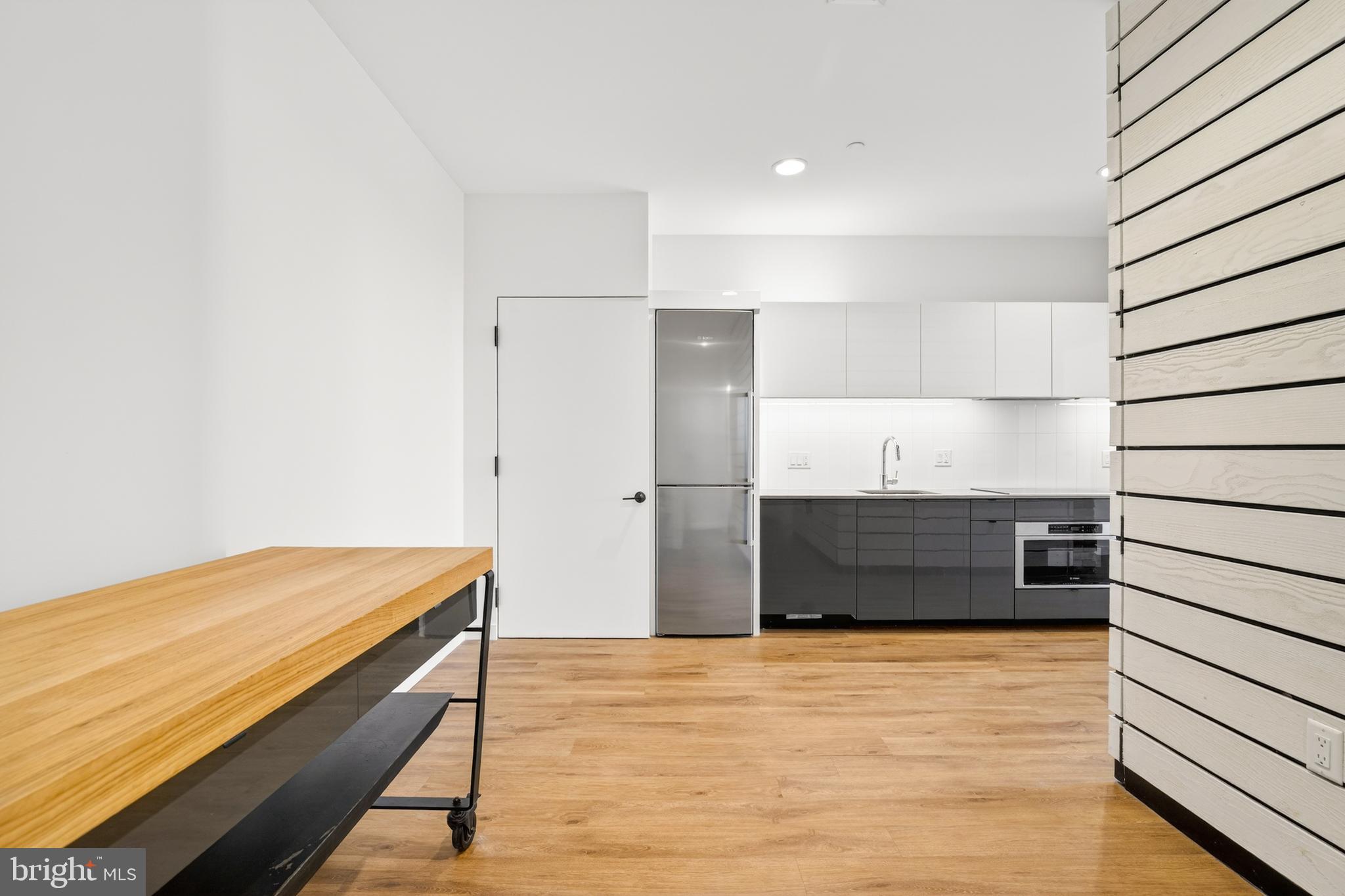 57 N Street Northwest, Unit 302 Washington, DC 20001 - Photo 8 of 34 a room with closet and wooden floor