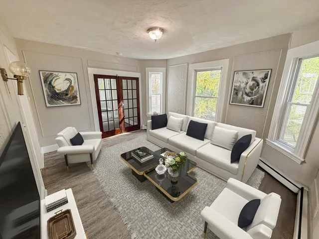 a living room with furniture and a window