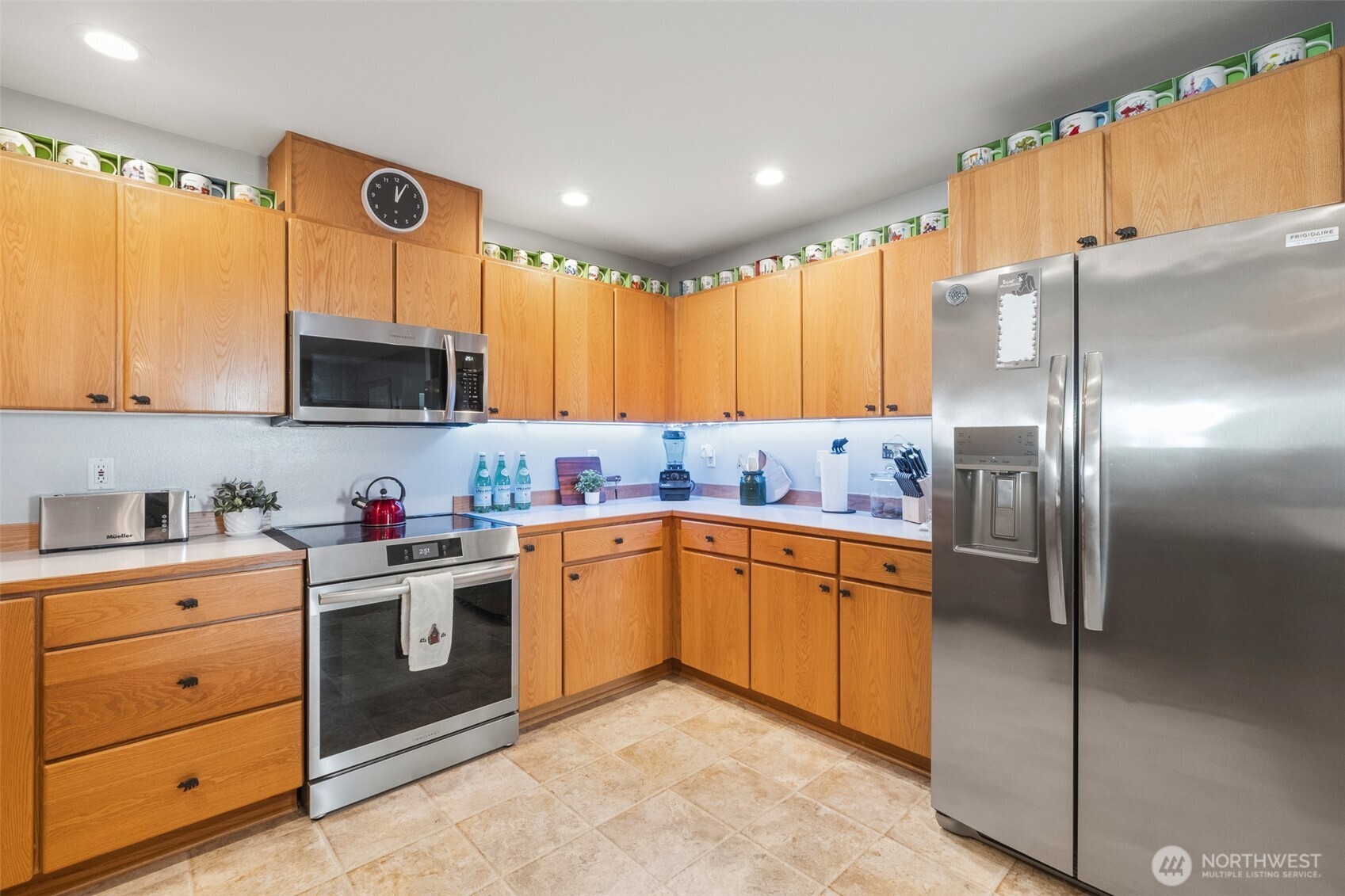 8348 Main Street, Unit 1 Peshastin, WA 98847 - Photo 12 of 40 a kitchen with stainless steel appliances granite countertop a refrigerator sink and microwave