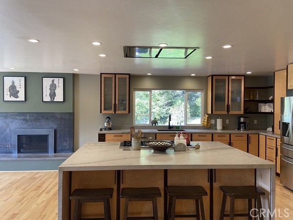 3402 Buttermilk Lane Arcata, CA 95521 - Photo 15 of 48 a kitchen with a dining table chairs and fireplace