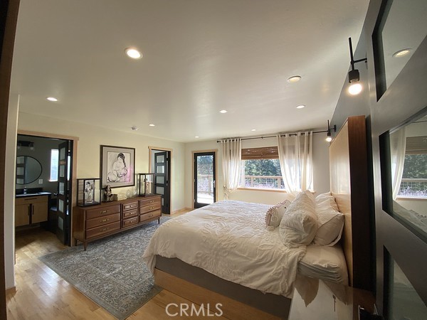 3402 Buttermilk Lane Arcata, CA 95521 - Photo 25 of 48 a bedroom with a bed couch and kitchen view