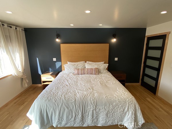 3402 Buttermilk Lane Arcata, CA 95521 - Photo 26 of 48 a bedroom with a bed and a flat tv screen