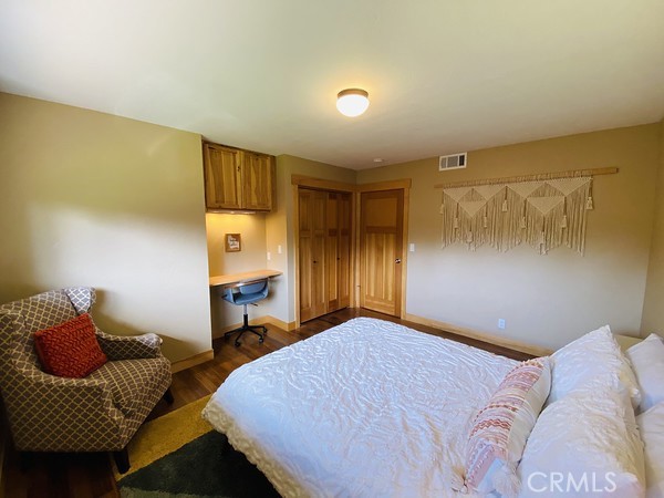 3402 Buttermilk Lane Arcata, CA 95521 - Photo 31 of 48 a bedroom with a bed and dresser