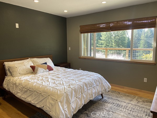 3402 Buttermilk Lane Arcata, CA 95521 - Photo 32 of 48 a bedroom with a bed and a window
