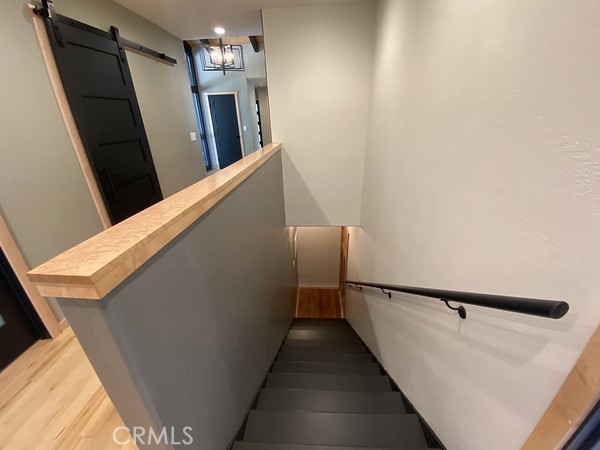 3402 Buttermilk Lane Arcata, CA 95521 - Photo 36 of 48 a view of staircase with lots of frames on wall and stairs