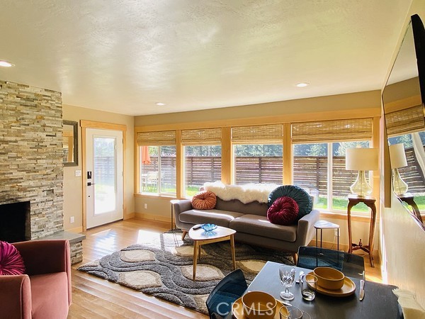 3402 Buttermilk Lane Arcata, CA 95521 - Photo 38 of 48 a living room with furniture and floor to ceiling windows