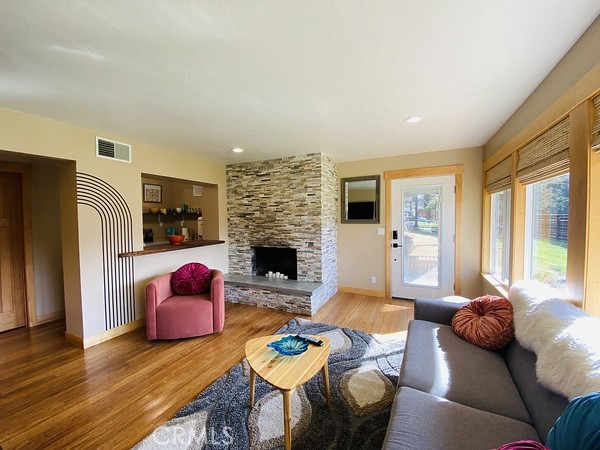 3402 Buttermilk Lane Arcata, CA 95521 - Photo 41 of 48 a living room with furniture fireplace and a large window