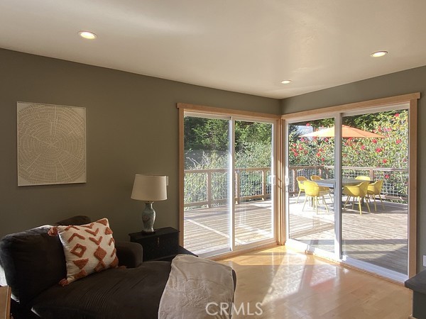 3402 Buttermilk Lane Arcata, CA 95521 - Photo 10 of 48 a living room with furniture and a floor to ceiling window