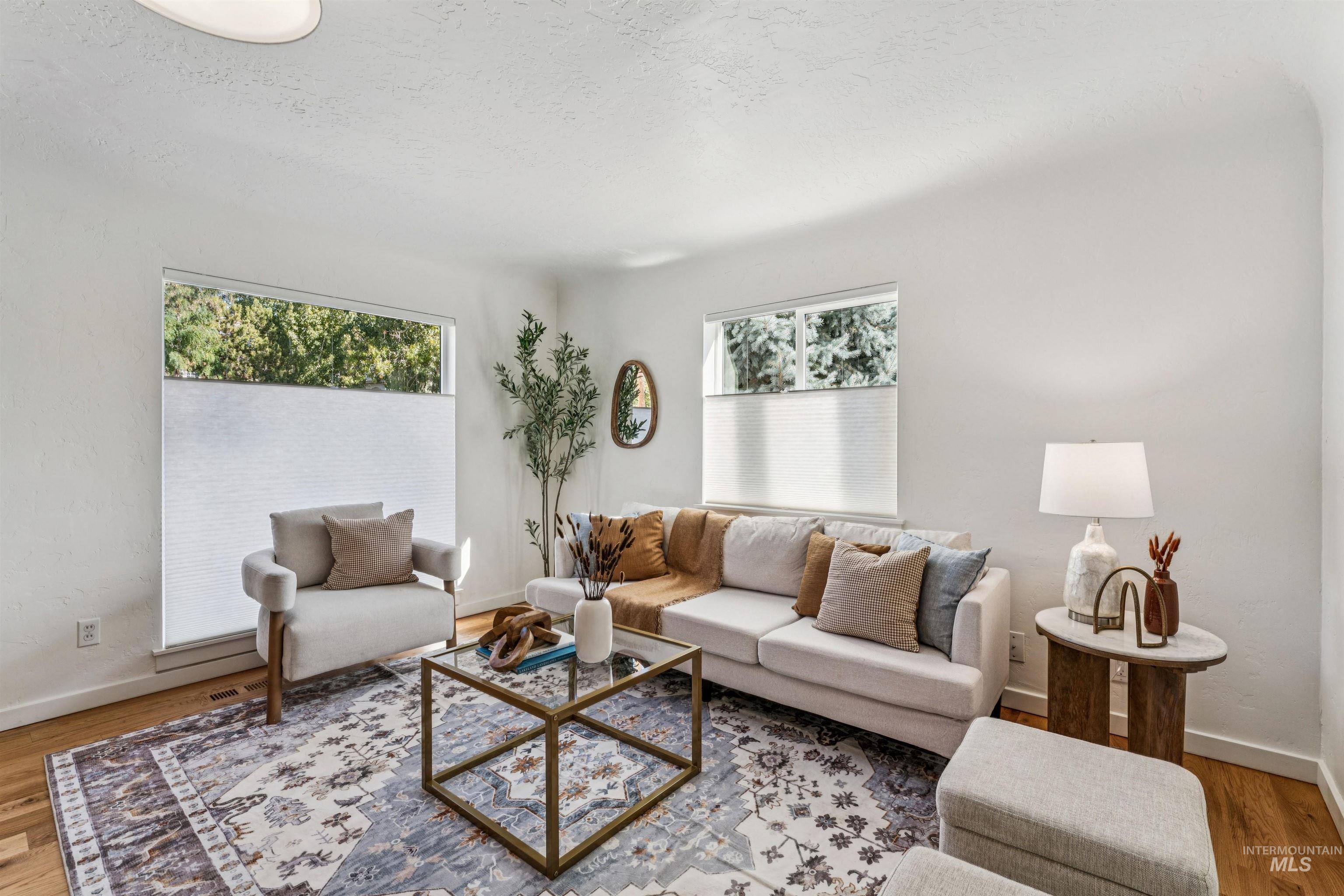2419 West Hill Road Boise, ID 83702 - Photo 12 of 50 Great room with wood finished floors and a textured ceiling