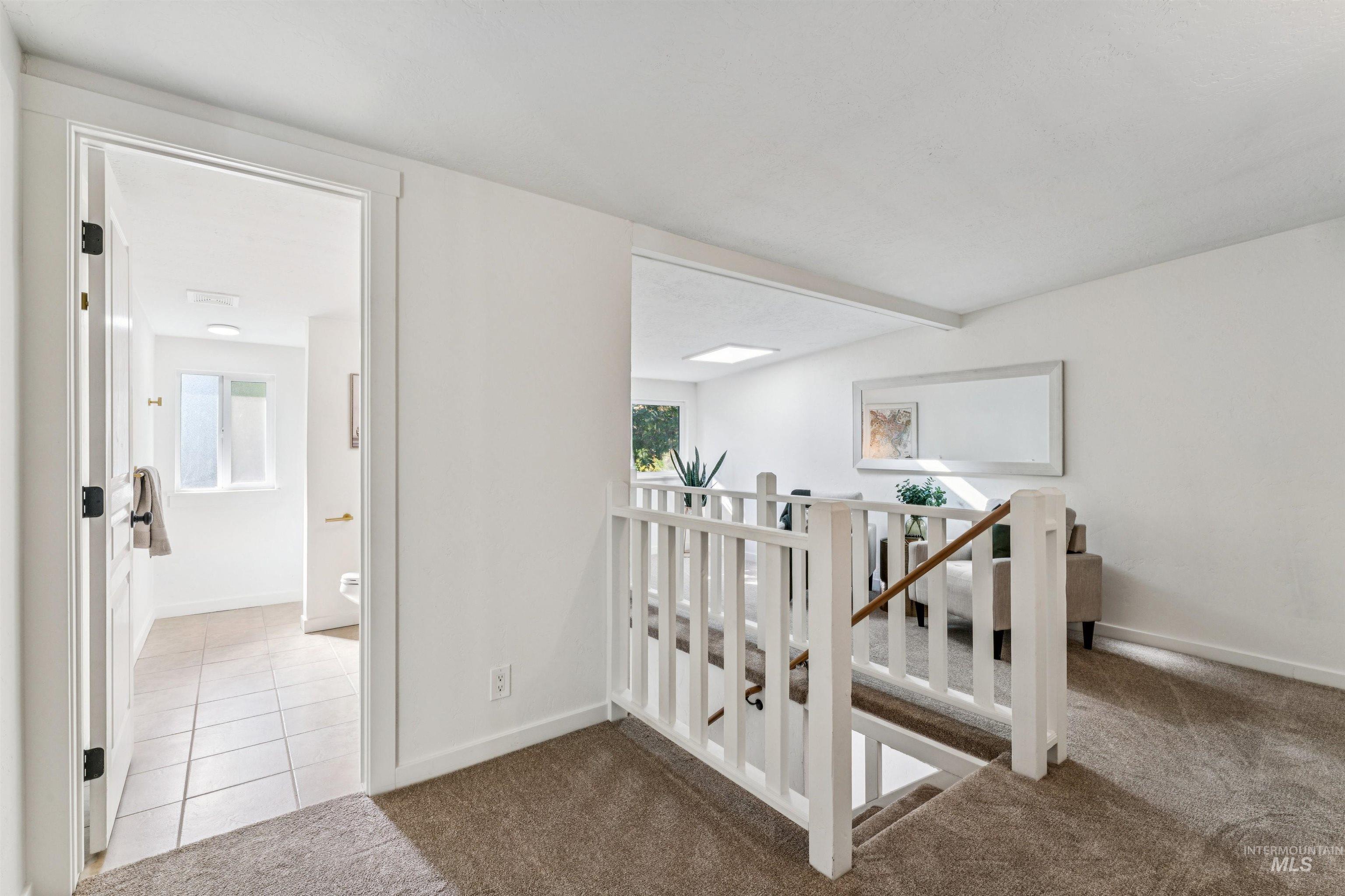 2419 West Hill Road Boise, ID 83702 - Photo 24 of 50 Loft featuring carpet, plenty of natural light, and tile patterned flooring