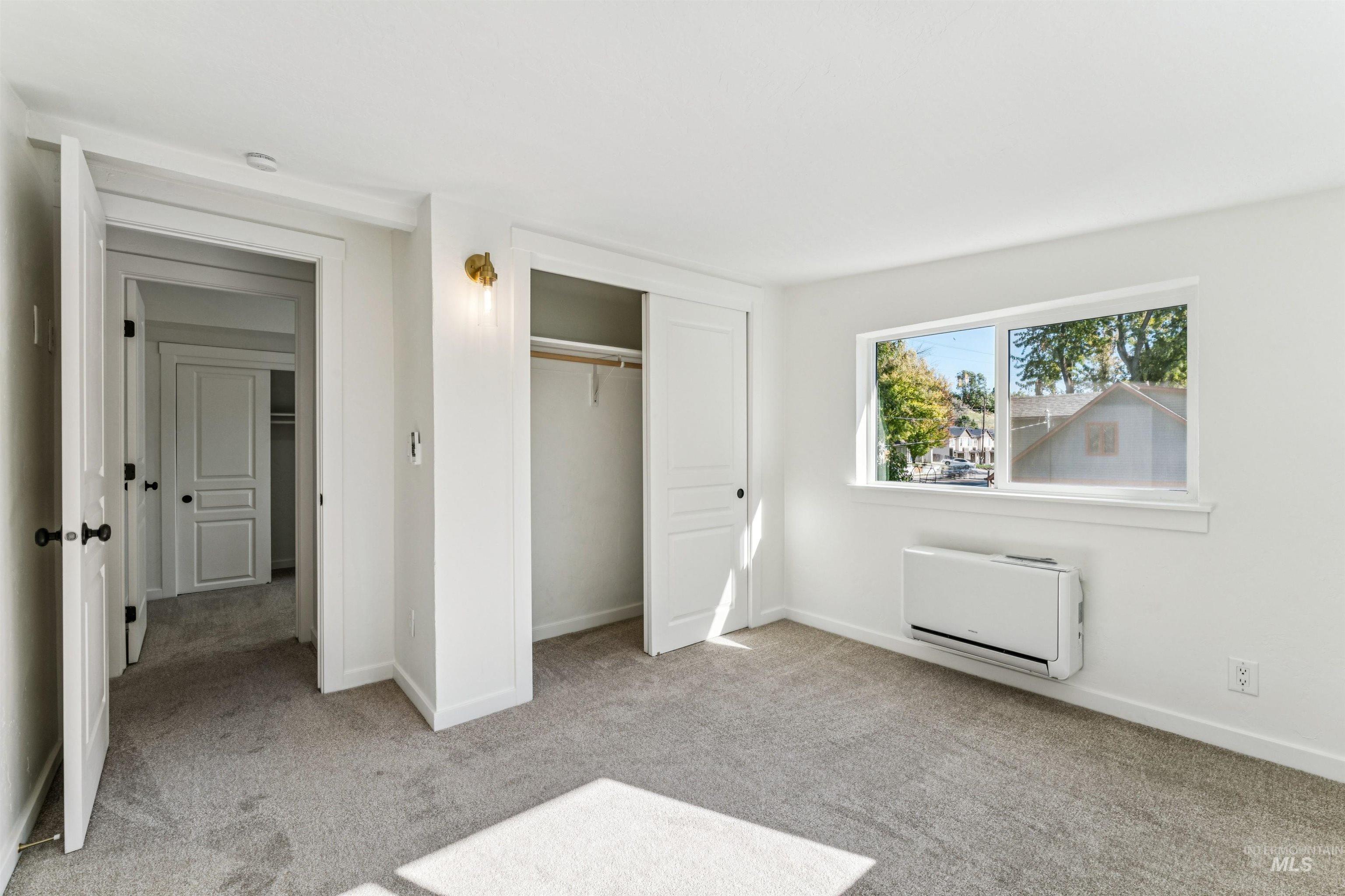 2419 West Hill Road Boise, ID 83702 - Photo 26 of 50 Unfurnished bedroom with light carpet and a closet