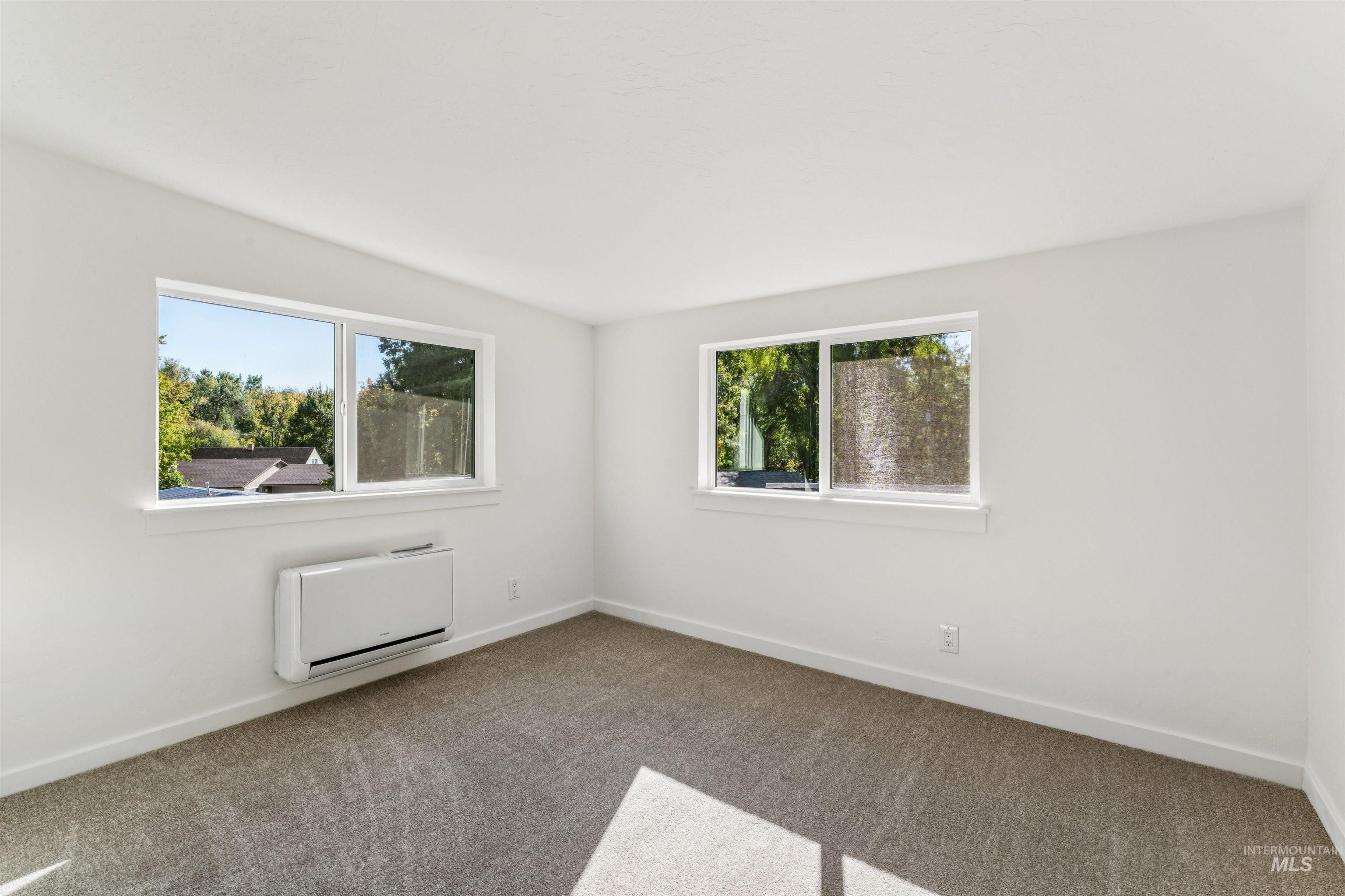 2419 West Hill Road Boise, ID 83702 - Photo 27 of 50 Carpeted spare room featuring baseboards