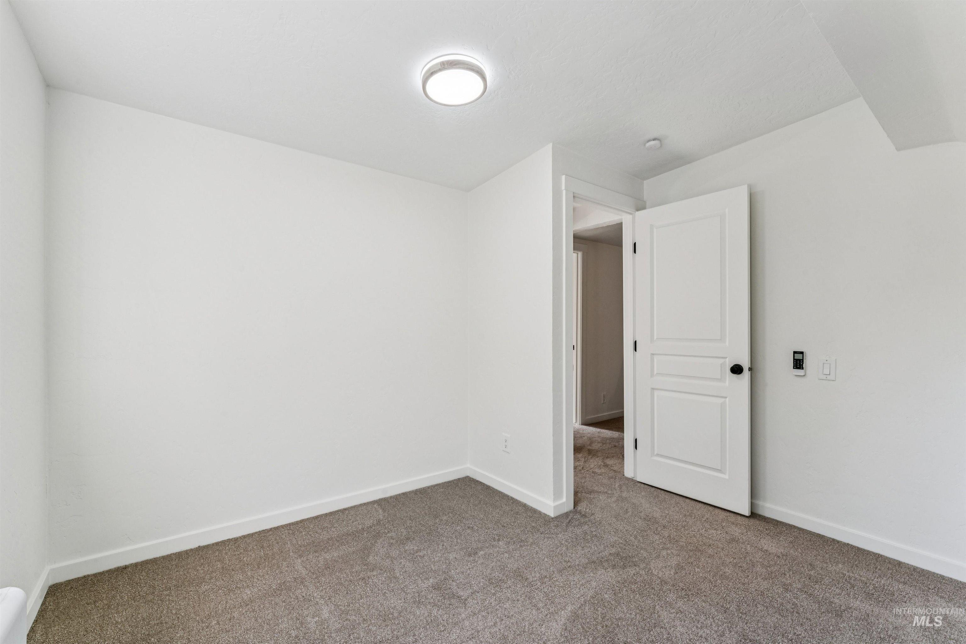 2419 West Hill Road Boise, ID 83702 - Photo 28 of 50 Unfurnished bedroom featuring carpet flooring and baseboards