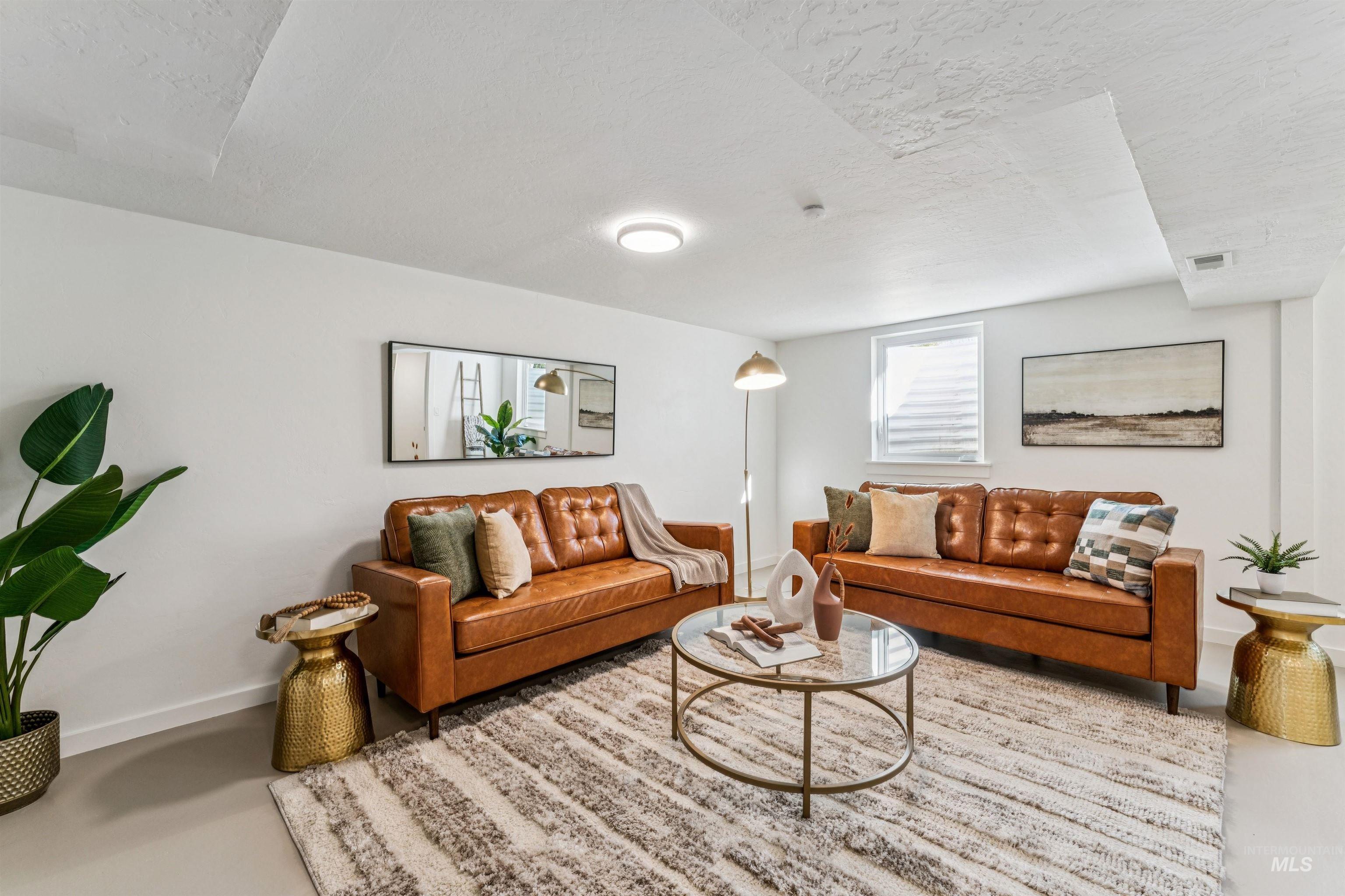 2419 West Hill Road Boise, ID 83702 - Photo 31 of 50 Living room area with a textured ceiling and concrete floors