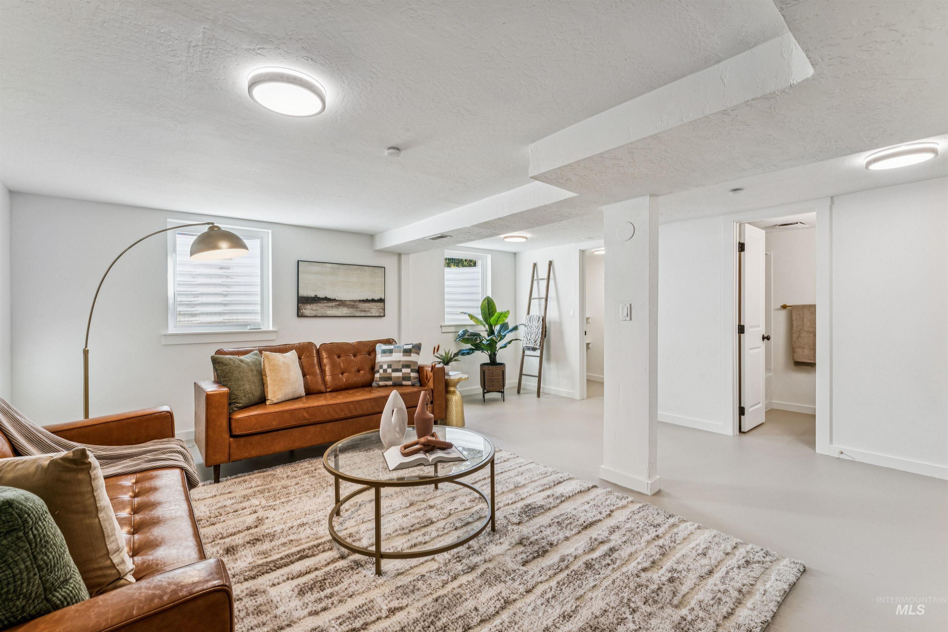 2419 West Hill Road Boise, ID 83702 - Photo 32 of 50 Primary Suite 2 with a textured ceiling and finished concrete floors