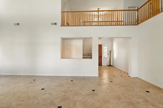 a living room with furniture tv and a fireplace