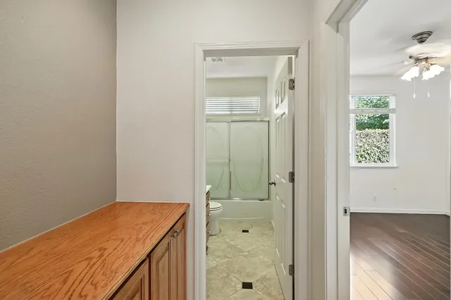 an empty room with wooden floor and closet